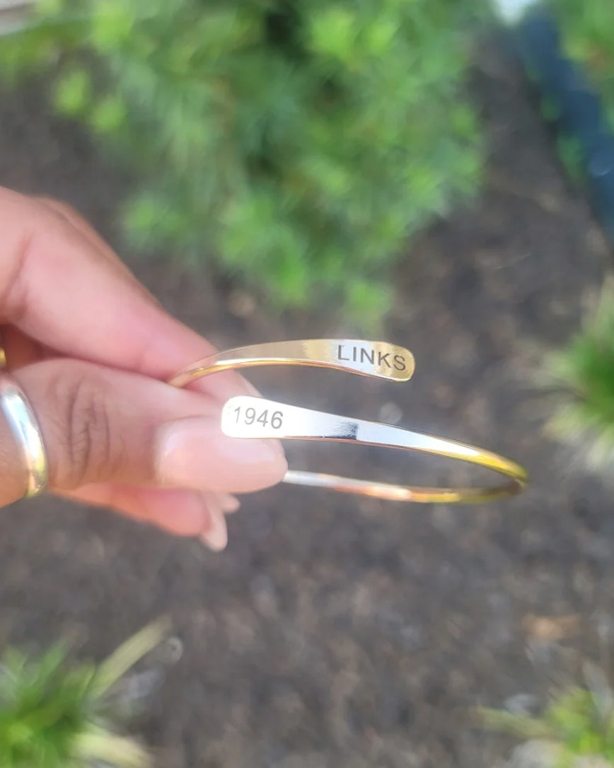 The LINKS 1946, Inc. Adjustable Cuff Bracelet Available in Silver & Gold