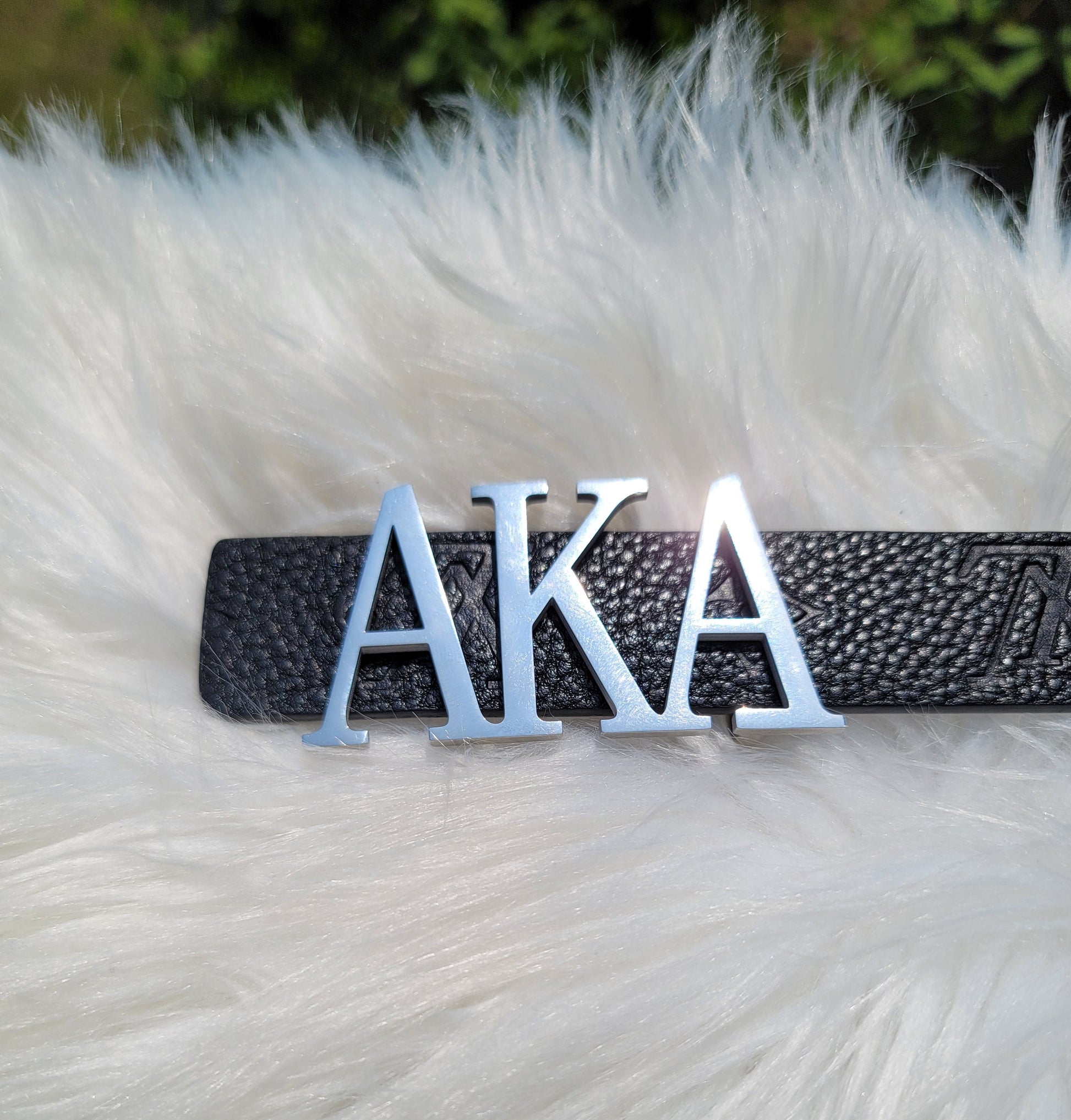 Sorority Greek letter belt   Made from quality material, the buckle will not tarnish nor fade  Material: stainless steel (with belt buckle only, belt not included) height 1.575 inches, width 3 inches.  The weight of the buckle is approximately 12 ounces.  NOTE: Belt used for display purposes only, not included with the purchase of the buckle.