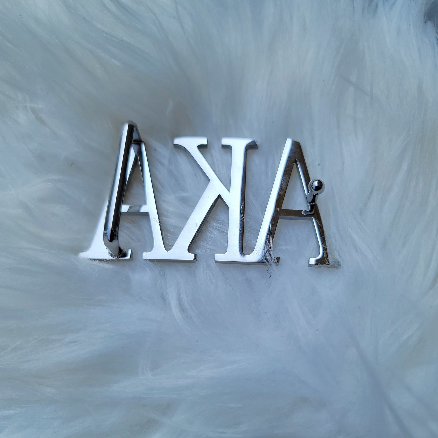 Sorority Greek letter belt   Made from quality material, the buckle will not tarnish nor fade  Material: stainless steel (with belt buckle only, belt not included) height 1.575 inches, width 3 inches.  The weight of the buckle is approximately 12 ounces.  NOTE: Belt used for display purposes only, not included with the purchase of the buckle.