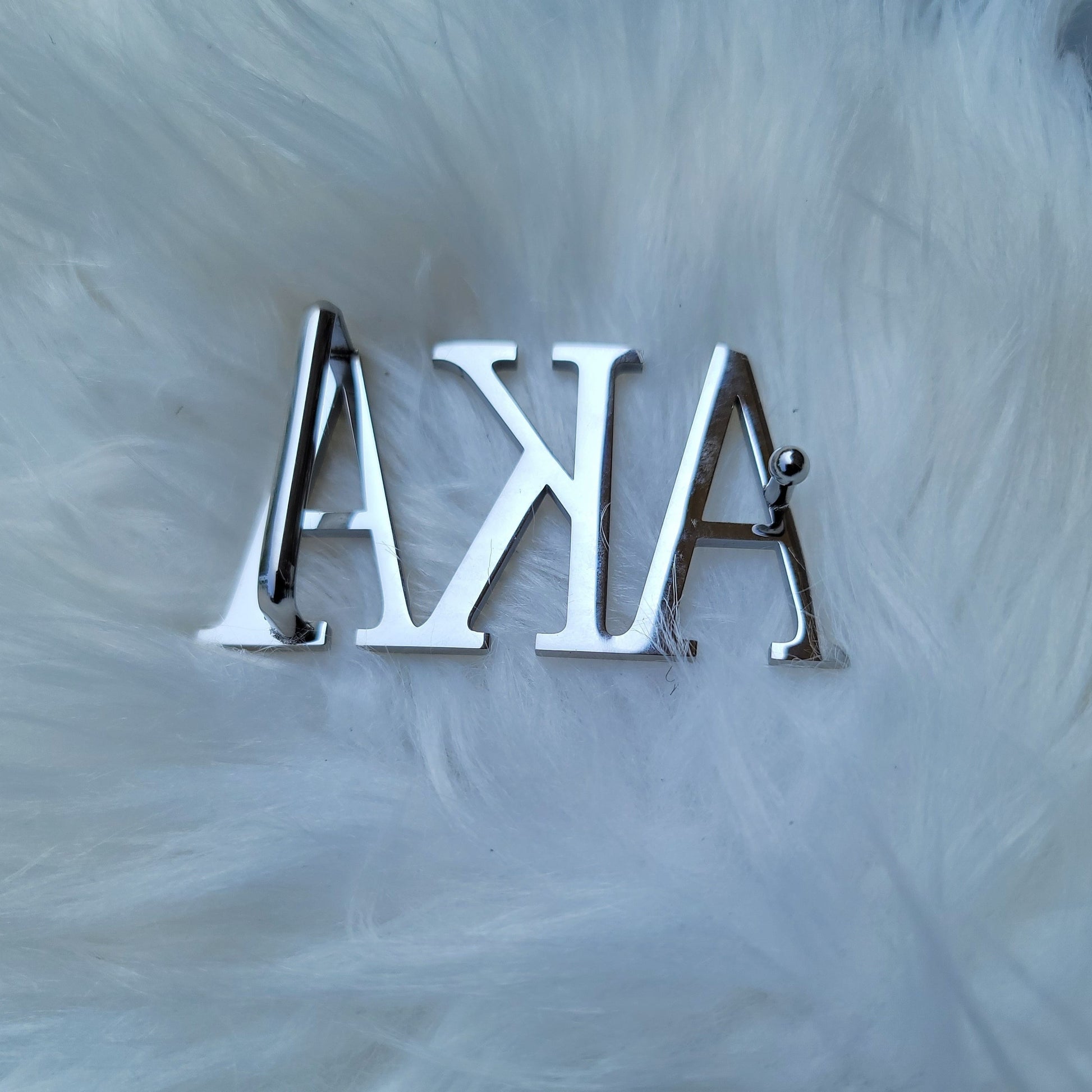 Sorority Greek letter belt   Made from quality material, the buckle will not tarnish nor fade  Material: stainless steel (with belt buckle only, belt not included) height 1.575 inches, width 3 inches.  The weight of the buckle is approximately 12 ounces.  NOTE: Belt used for display purposes only, not included with the purchase of the buckle.