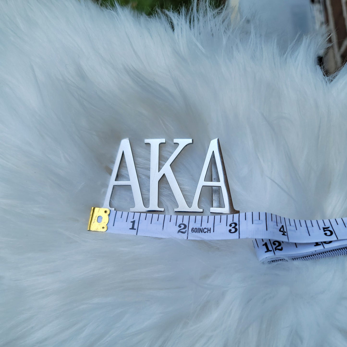 Sorority Greek letter belt   Made from quality material, the buckle will not tarnish nor fade  Material: stainless steel (with belt buckle only, belt not included) height 1.575 inches, width 3 inches.  The weight of the buckle is approximately 12 ounces.  NOTE: Belt used for display purposes only, not included with the purchase of the buckle.