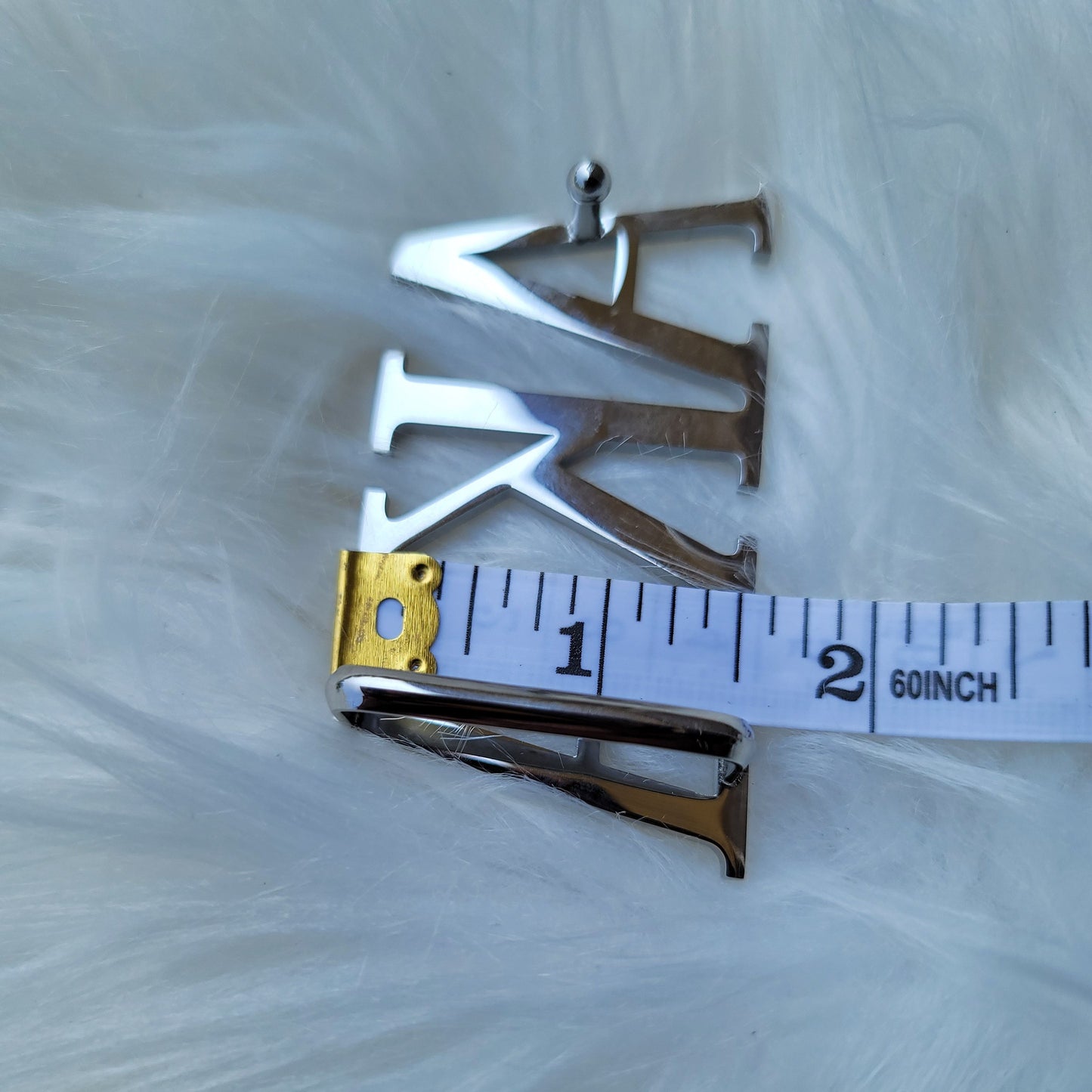 Sorority Greek letter belt   Made from quality material, the buckle will not tarnish nor fade  Material: stainless steel (with belt buckle only, belt not included) height 1.575 inches, width 3 inches.  The weight of the buckle is approximately 12 ounces.  NOTE: Belt used for display purposes only, not included with the purchase of the buckle.