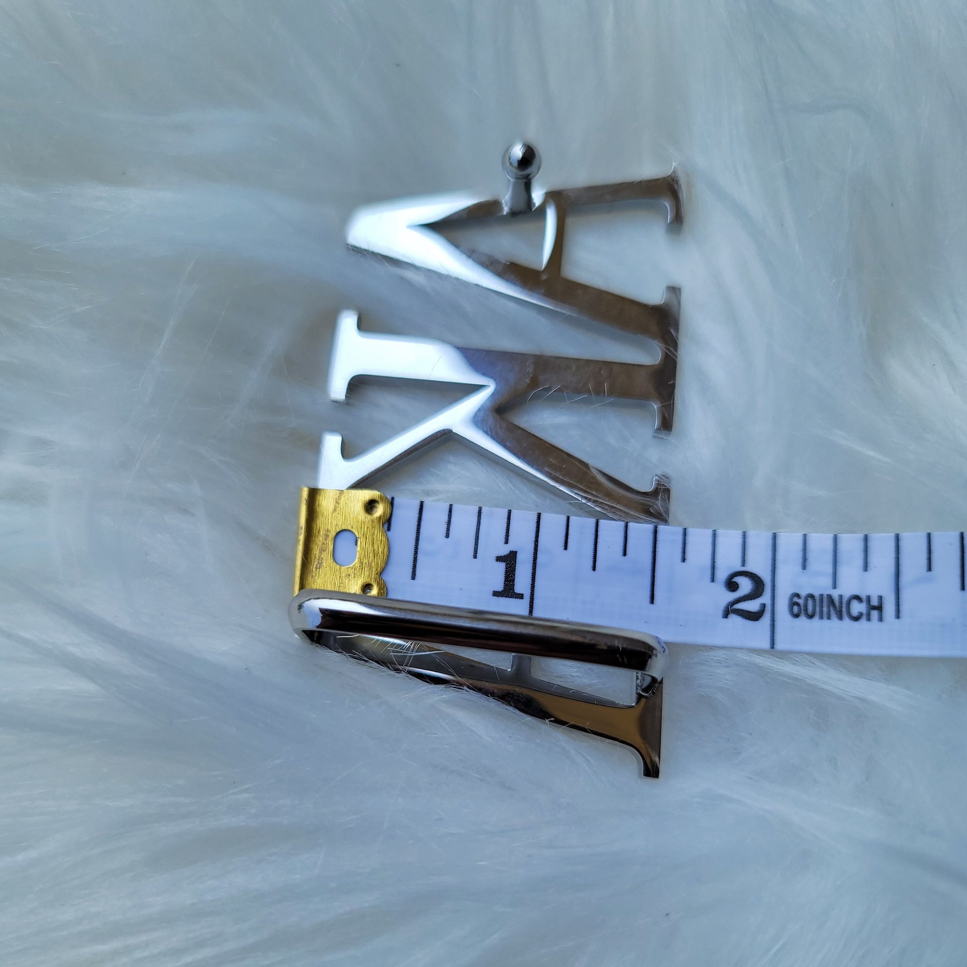 Sorority Greek letter belt   Made from quality material, the buckle will not tarnish nor fade  Material: stainless steel (with belt buckle only, belt not included) height 1.575 inches, width 3 inches.  The weight of the buckle is approximately 12 ounces.  NOTE: Belt used for display purposes only, not included with the purchase of the buckle.